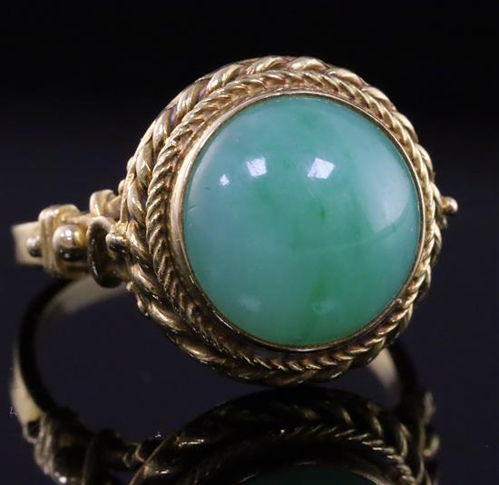An early-mid 20th century 18ct gold and cabochon jadeite set dress ring size P/Q.